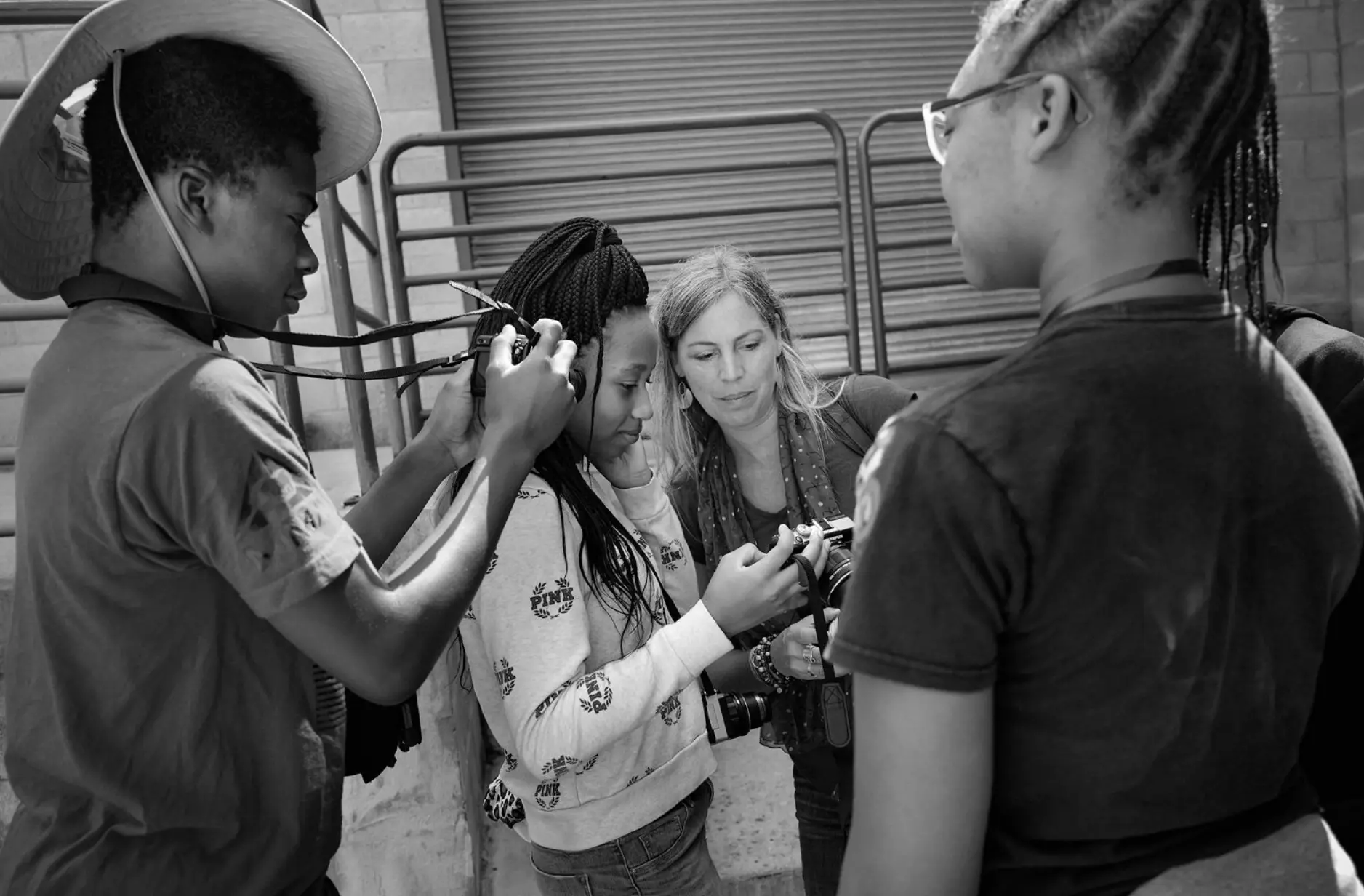 Students and mentors in a hands-on photography workshop