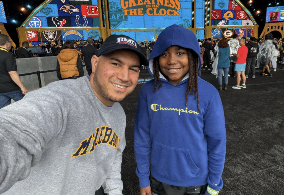 Mentor and young mentee together at an event