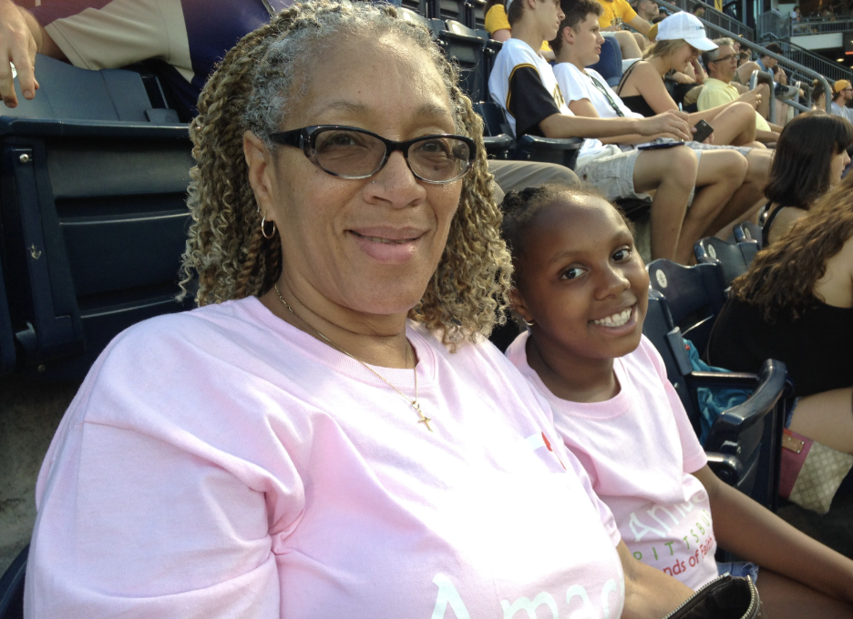 Grandmother and granddaughter enjoying a Pirates game together